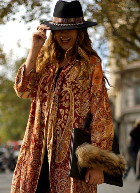 Women's brown handbag with fur handle